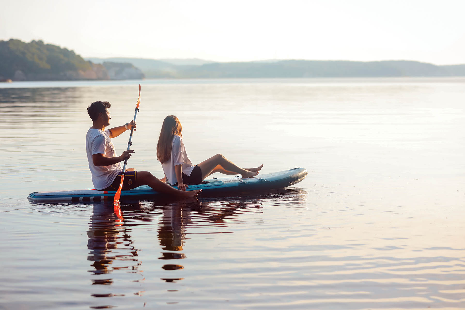 couple paddleboarding